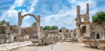 Ruins of The Domitian square and Domitian Temple in Ephesus, Turkey in antique Ephesus city on a sunny summer day