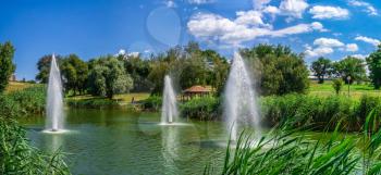 Zaporozhye, Ukraine 07.21.2020. Small pond in Voznesenovsky park on a sunny summer morning