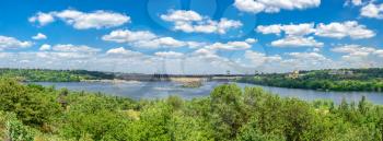 Zaporozhye, Ukraine 07.20.2020. Panoramic view of the Dnieper hydroelectric power station from the Khortytsya island in Zaporozhye, Ukraine, on a sunny summer day