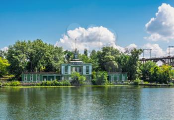 Dnipro, Ukraine 07.18.2020. Old water station on the Dnieper river and  Monastery island in Dnipro, Ukraine, on a sunny summer day