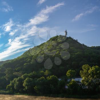 Svyatogorsk, Ukraine 07.16.2020.  Monument to Artem on the mountain above the Svyatogorsk or Sviatohirsk lavra on a sunny summer morning
