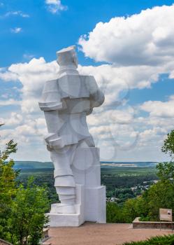 Svyatogorsk, Ukraine 07.16.2020.  Monument to Artem on the mountain above the Svyatogorsk or Sviatohirsk lavra on a sunny summer morning