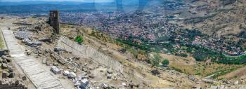 The ruins of an Ancient Theatre in the greek city of Pergamon in Turkey on a sunny summer day. Big size panoramic view
