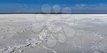 White Salty drying lake under the blue sky in Rybakovka, Odessa region, Ukraine. Big size panoramic photo
