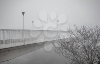 Odessa, Ukraine 11.28.2019.   Mother-in-law bridge in Odessa, Ukraine, on a foggy autumn day