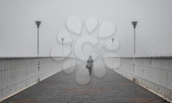 Odessa, Ukraine 11.28.2019.   Mother-in-law bridge in Odessa, Ukraine, on a foggy autumn day