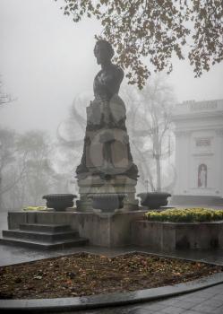 Odessa, Ukraine 11.28.2019.  Monument to Alexander Pushkin on Primorsky Boulevard in Odessa, Ukraine, on a foggy autumn day