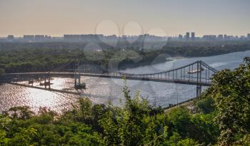 Kyiv, Ukraine 07.11.2020. View of the Dnieper River and the city of Kyiv, Ukraine, from the pedestrian bridge on a sunny summer morning