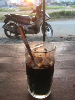 Coffee on the street in the morning, the way Vietnamese enjoy their cafe da iced coffee. Mobile photo