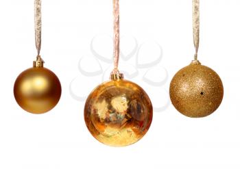 Three golden balls isolated on white background