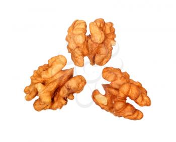 Three peeled walnuts isolated on white background