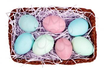 Basket with colorful easter eggs isolated on a white background