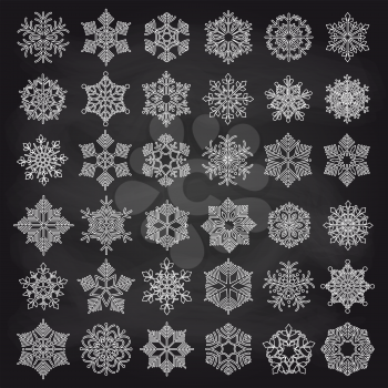 White ounline showflakes set on chalkboard background. Vector illustration
