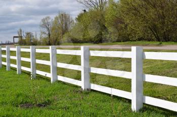 WhiteWhite wooden fence around the ranch. Wooden fence in the village. 