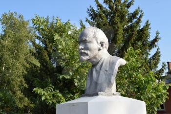 Old monument to Lenin. A concrete bust of Lenin near recreation center in the rural settlement.