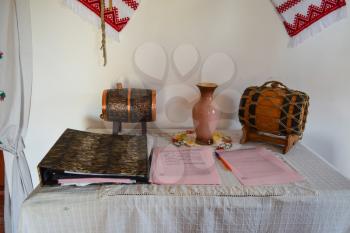 Russia, Ataman - 26 September 2015: Table with souvenir kegs and gratitude records of visitors.