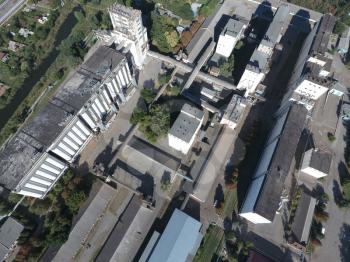 Top view of a silo elevator. The huge building for storing and drying grain. Aerophotographing industrial object.