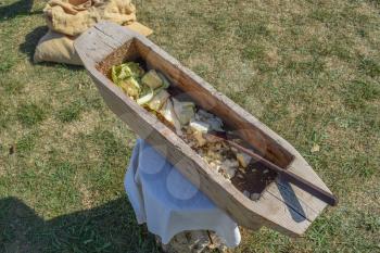 Wooden trough for cutting cabbage. Antique household items in the village.