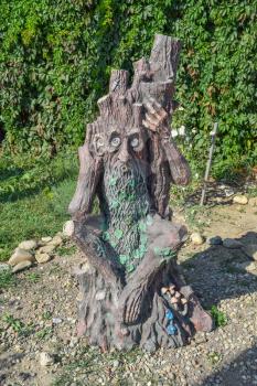 Spirit of the forest. Statue of demon in the form of forest wooden creatures.