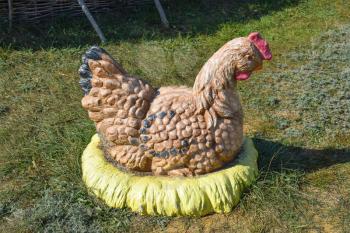 Monument chicken hen. Dummy hen on the nest, the figure of the mother hen.