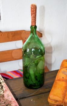 Tincture of horseradish and parsley on moonshine. A bottle of liqueur plugged corncobs.