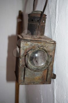 Restored vintage kerosene lantern with a lens.