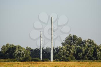 Power line support, insulators and wires. Appearance of a design. 