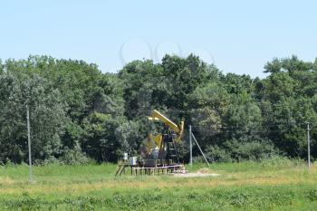 The pumping unit as the oil pump installed on a well. Equipment of oil fields.