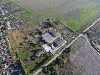 Top view of the village. Abandoned and plundered ether-oil factory in the village. Village bird's-eye view.