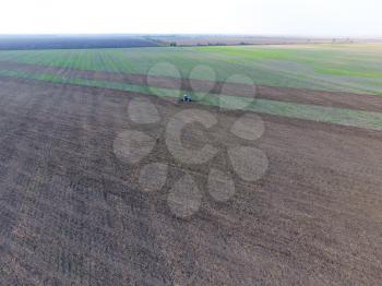 Top view of the tractor that plows the field. disking the soil. Soil cultivation after harvest.