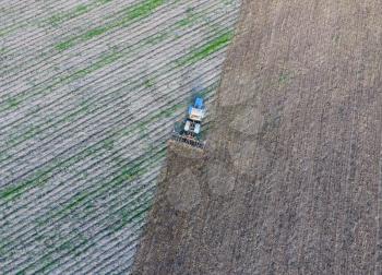 Top view of the tractor that plows the field. disking the soil. Soil cultivation after harvest.
