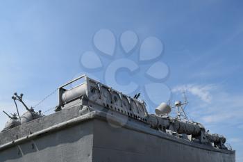 Part of the deck of a warship. communication devices and deck guns