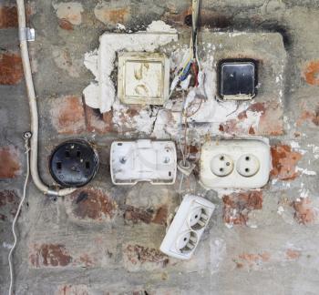 Old panel with switches and sockets. Old electrical wiring.