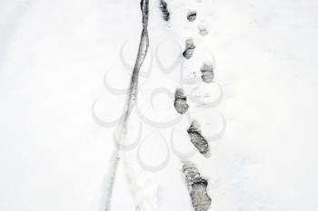Human footprints in the snow. The path in the snow.