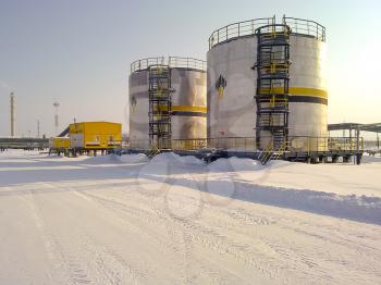 Russia, Nefteyugansk - January 24, 2016: A view of oil field equipment. Tanks with oil owned oil company Rosneft.