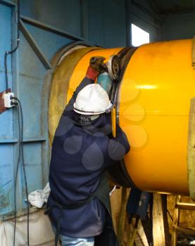 Safety at work. Welding and grinding of iron constructions. Industrial weekdays welders and fitters.