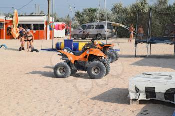 Russia, Achuevo - August 2, 2015: A small quad bike rentals. Rental services on the beach by the sea.