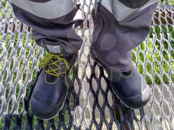 Overalls of the oil industry worker. Boots and trousers.