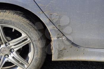 Poltavskaya village, Russia - January 15, 2017: The mud on the wheels, fenders and car doors. The result is a trip through the mud. Dirty car.