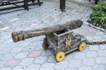 Fake guns. Wooden decorative cannon in the park.