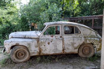 Poltavskaya village, Russia - July 28, 2015: Old rusty Soviet car Victory . Rare exhibit
