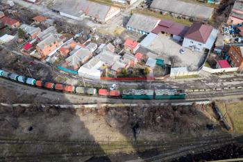 Freight train traveling through the city buildings