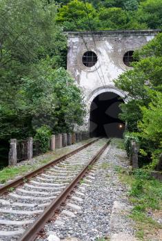 Tunnel in the mountain. The railroad through the mountain.
