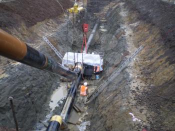 Sakhalin, Russia - 12 November 2014: Laying of the gas pipeline in a ditch. Installation works.