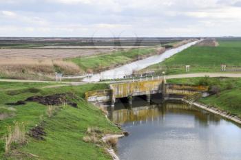 Bridges through irrigation canals. Rice field irrigation system.
