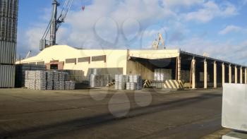 A port warehouse of aluminum ingots. Warehouse goods.