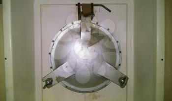 The porthole of the porthole in the ship's cabin.