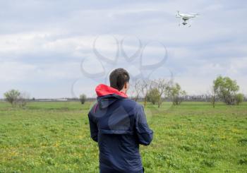 A man with a remote control in his hands. Flight control of the drone. Phantom.