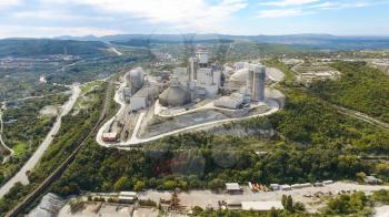 Verkhnebakansky cement plant, top view. Factory for the production and preparation of building cement. Cement industry.