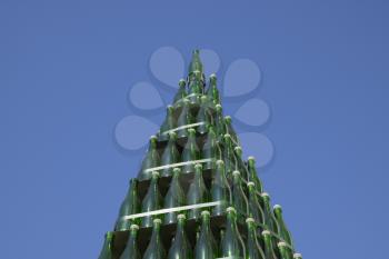 Christmas tree of bottles of champagne. Creative from bottles. Empty bottles of champagne.